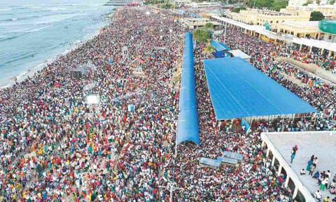 A large number of devotees throng the shore temple to witness the holy event on Monday 