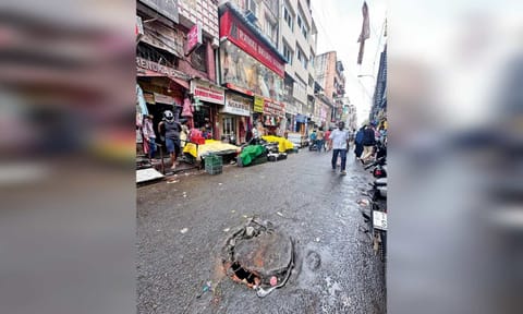 Broken and partially open manhole on busy Mint Street posing a threat