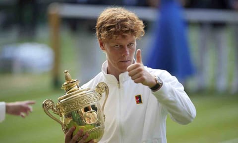 Italy's Jannik Sinner celebrates with the trophy after beating Carlos Alcaraz of Spain to win the men's singles final at the Wimbledon Tennis Championships in London, Sunday, July 13, 2025 (AP) 