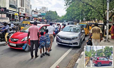 Traffic congestion on Kilpauk Garden Road in the evening as cars and auto being parked