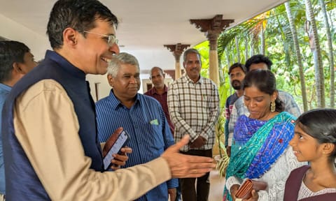 IIT-M director V Kamakoti interacting with a school student during his visit to Auroville 