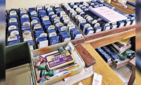 Log books and stamp pads in a public library that are used to track books yet to be returned by members