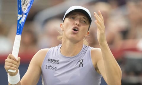 Iga Swiatek, of Poland, reacts during her match against Clara Tauson, of Denmark, during round of 16 action at the National Bank Open women's tennis tournament in Montreal, Sunday, Aug. 3, 2025. (AP) 