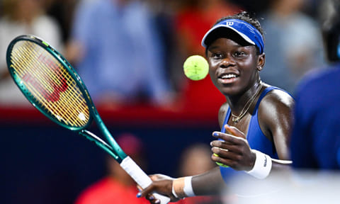 Victoria Mboko plays a shot during the match 