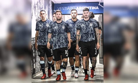 Messi and Argentina players walk out of the tunnel during a match 