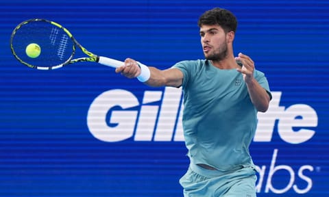 Carlos Alcaraz plays a forehand shot against Alexander Zverev