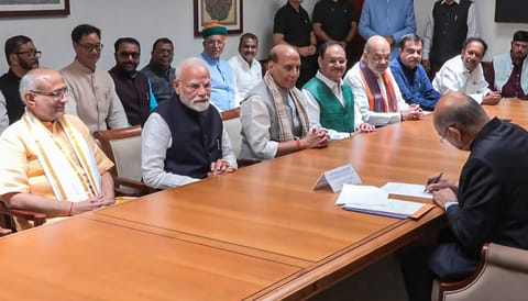 Prime Minister Narendra Modi flanked by Maharashtra Governor and NDA's candidate CP Radhakrishnan as the latter files the nomination papers for vice presidential elections, in New Delhi. Defence Minister Rajnath Singh also seen (PTI) 