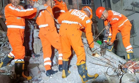 NDRF personnel during a rescue operation after the rear portion of a four-storey building crashed onto a chawl at Vasai, in Palghar district, Maharashtra (PTI)