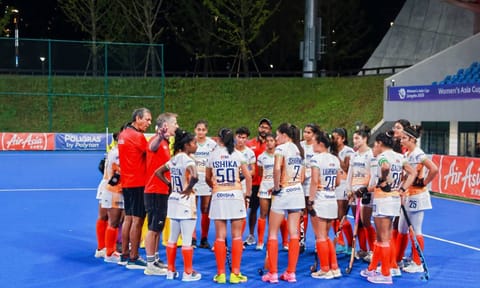 Indian players gathered for a team huddle after the match