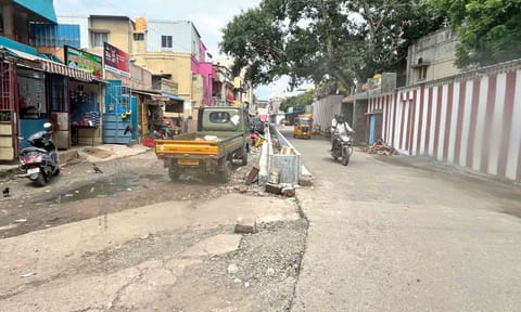 Vehicles parked on the 40-foot road in Kolathur 