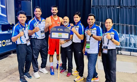 Lakshya Chahar with his coaches after the win