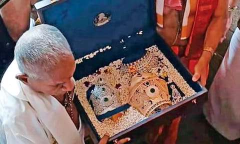 Music composer Ilaiyaraaja offering the precious crown to Goddess Mookambika at the famed temple in Kollur 