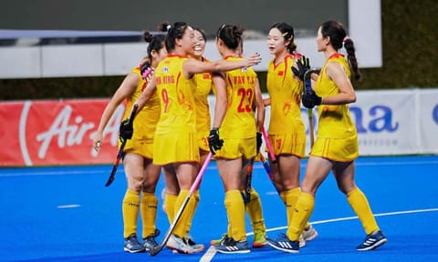 Chinese players celebrate after scoring against India 