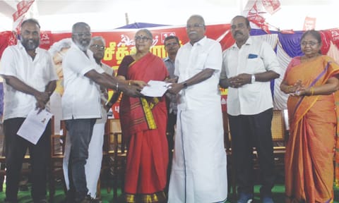 CPM polit bureau member K Balakrishnan handing over a will to donate his body at Yechury’s death anniversary event on Friday