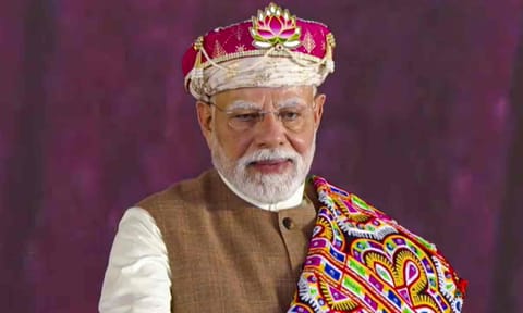 Prime Minister Narendra Modi being presented a memento by Madhya Pradesh Chief Minister Mohan Yadav, during the foundation stone laying ceremony of the PM Mitra Park, at Bhensola village in Badnawar tehsil of Dhar district, in Madhya Pradesh (PTI) 