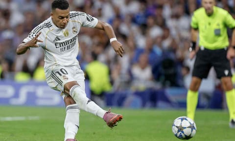 Kylian Mbappe takes a shot from the penalty spot 