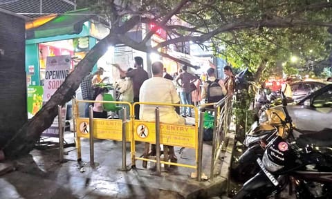 Barricades in place on the pavement near one of the exits of Tirumangalam Metro station 