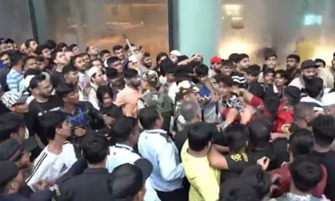 Excited customers queuing up outside the country's first Apple Store since early hours (Screengrab/X)
