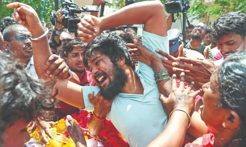 Relatives of the victims mourn in front of Karur Government Medical College hospital, following the stampede at an election campaign rally addressed by TVK leader Vijay