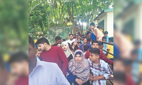 Tourists patiently wait for a boat ride in Yelagiri Hills