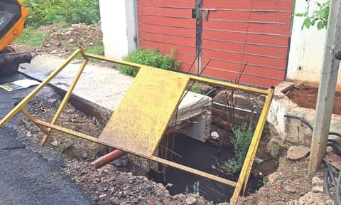 A barricade that fell into an incomplete SWD in Balaji Nagar 2nd Street, Ranga Reddy Gardens, Neelankarai 