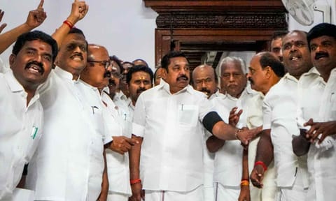 Leader of Opposition in Tamil Nadu Assembly Edappadi K Palaniswami and other AIADMK MLAs raise slogans wearing black armbands as they stage a walkout amid the ongoing state Assembly session, at Fort St. George, in Chennai, Wednesday, Oct. 15, 2025. (PTI) 