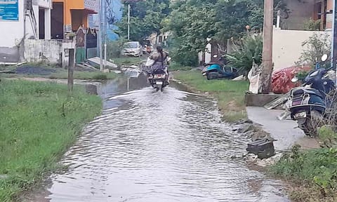  A two-wheeler plying on the sewage-filled 5th Street in East Gopalapuram