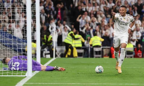 Kylian Mbappe celebrates after scoring his second goal 