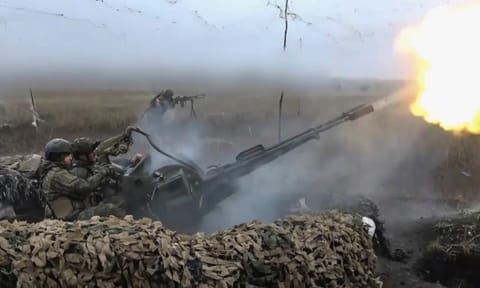 Russian army soldiers fire to shoot a Ukrainian drone on an undisclosed location in Ukraine. (Photo: AP)