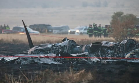 Debris is seen at a crash site of a Turkish military cargo plane in Georgia's Sighnaghi municipality, close to the Azerbaijani border (AP)