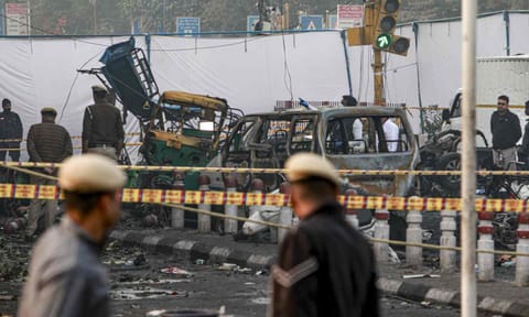 Charred remains of vehicles at a cordoned off area following a blast that occurred near Red Fort Metro Station on Monday, killing at least nine people and gutting several vehicles, in New Delhi, Tuesday, Nov. 11, 2025 (PTI) 