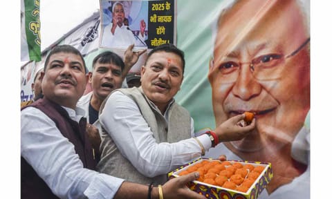 JDU members celebrate as the NDA alliance leads during the counting of votes of the Bihar Assembly elections, in Patna, Friday, Nov. 14, 2025 (PTI) 