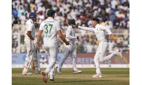 South Africa's Keshav Maharaj with teammates celebrates after the team wins during the third day of the first Test cricket match of a series between India and South Africa, at Eden Gardens in Kolkata, Sunday, Nov. 16, 2025 (PTI) 
