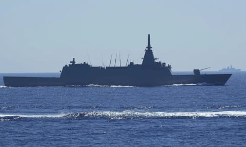 Japanese Maritime Self-Defence Force (JMSDF) frigate JS Noshiro maneuver as a Chinese navy ship is seen at right during the Philippines United States Japan Multilateral Maritime Cooperative Activity off a disputed South China Sea shoal on Friday, March 28, 2025. (AP) 