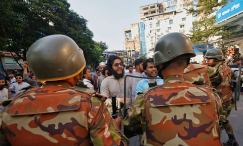 Police use baton to disperse protesters gather outside the demolished residence of Sheikh Mujibur Rahman, Bangladesh's former leader and the father of the country's ousted Prime Minister Sheikh Hasina after the verdict against Hasina, in Dhaka, Bangladesh, Monday, Nov. 17, 2025 (AP) 