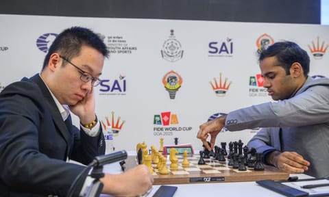  Grandmaster Arjun Erigaisi moves a pawn during his match