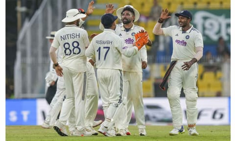 India's Mohammed Siraj, second right, celebrates with teammates after taking the wicket of South Africa's Tony de Zorzi on day one of the second Test cricket match of a series between India and South Africa, at ACA Stadium, Barsapara, in Guwahati, Saturday, Nov. 22, 2025 (PTI) 