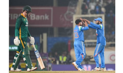 India's Kuldeep Yadav, back left, celebrates with Ravindra Jadeja, right, after taking the wicket of South Africa's Prenelan Subrayen during the first ODI cricket match of a series between India and South Africa, at JSCA International Stadium Complex, in Ranchi, Jharkhand, Sunday, Nov. 30, 2025 (PTI) 