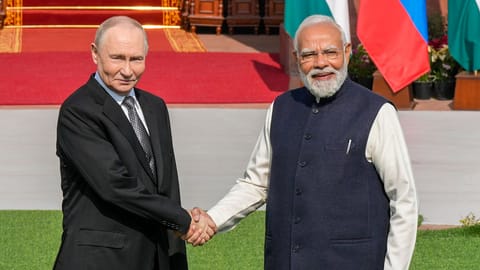 Prime Minister Narendra Modi receives Russian President Vladimir Putin ahead of their meeting at Hyderabad House