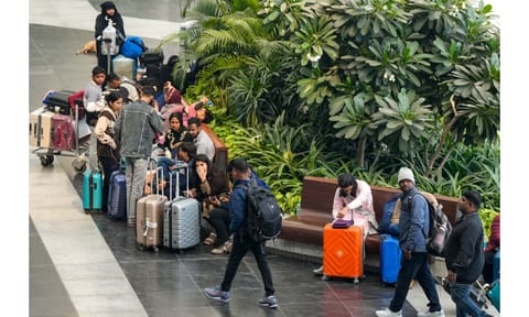 Passengers wait at Terminal 1 (T1) of the Indira Gandhi International Airport, in New Delhi, Saturday, Dec. 6, 2025 (PTI) 