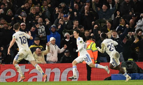 Ao Tanaka (C) celebrates after scoring the winner against Liverpool 