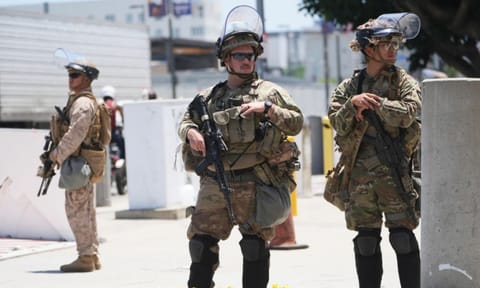 Members of the California National Guard and U.S. Marines guard a federal building in Los Angeles (AP) 