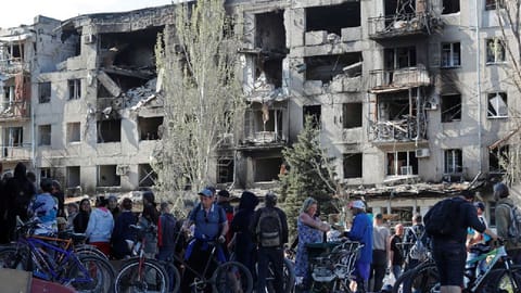 Local residents gather to receive humanitarian aid during Ukraine-Russia conflict in the southern port city of Mariupol, Ukraine