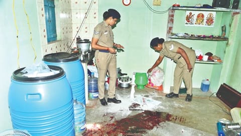 Police examine the crime scene at Tirupur on Monday