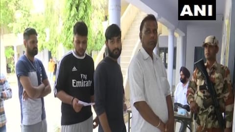 People queued outside a polling booth in Barnala