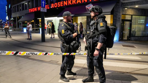 Security forces stand at the site