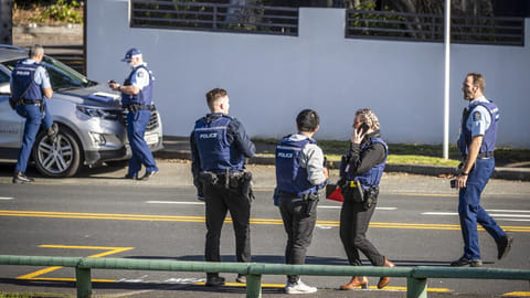 Police set up cordons and search area around a suburb