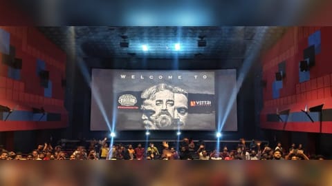 Fans celebrate the release of Vikram in a theatre in Chennai