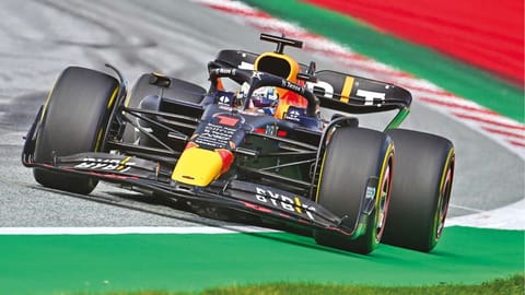 Max Verstappen celebrates after taking the pole position
