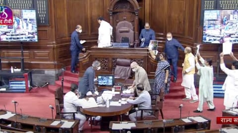 Opposition party MPs carried placards with slogans against price rise and GST, and with prices of essential goods before and after the Modi government came to power.
